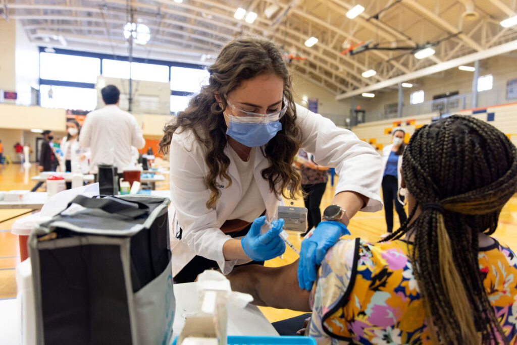 Nurse giving vaccine shot