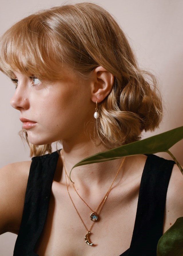 Model with crescent moon necklace