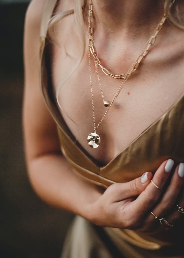 Model with gold layered necklace