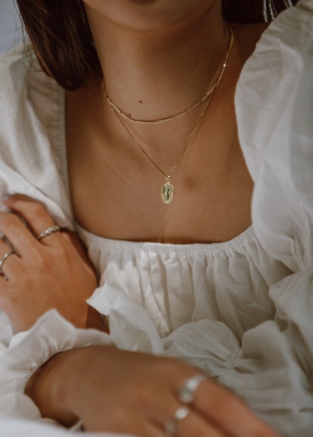 Model with gold pendant necklace